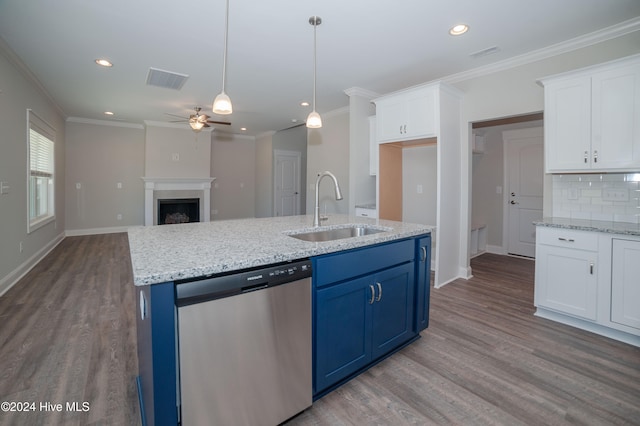 kitchen featuring a sink, blue cabinetry, white cabinets, and stainless steel dishwasher