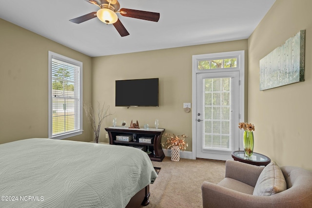 bedroom with carpet, multiple windows, baseboards, and ceiling fan