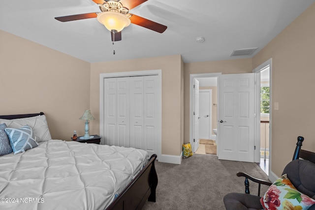 carpeted bedroom with ceiling fan and a closet