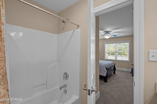 bathroom featuring shower / bath combo with shower curtain and ceiling fan