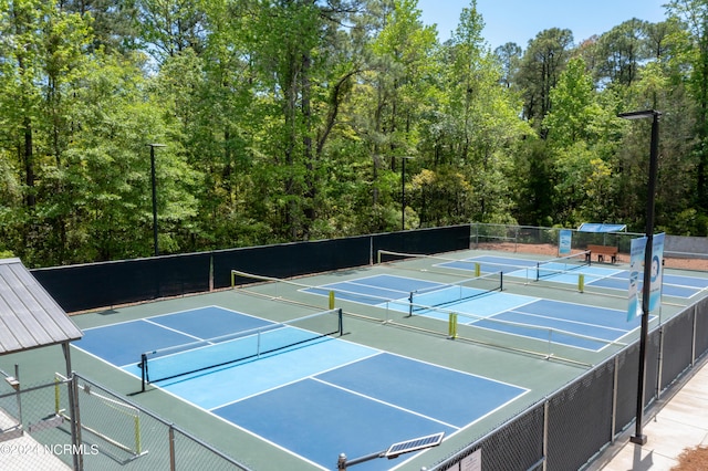 view of tennis court with fence