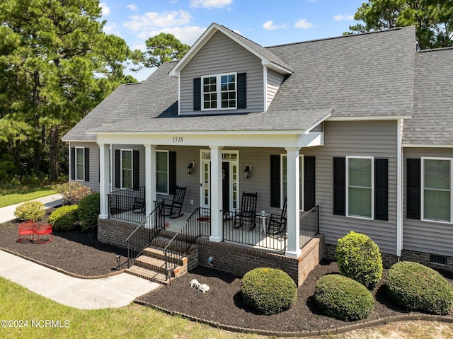 view of front of house featuring a porch and roof with shingles