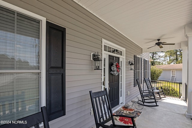 view of patio featuring ceiling fan and a porch