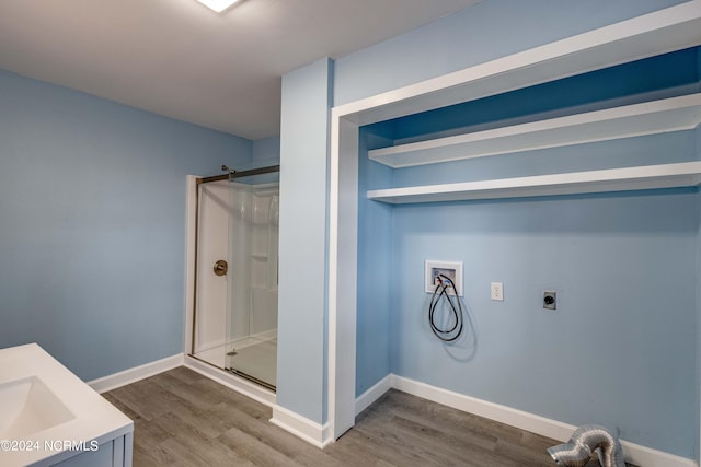 laundry room with wood-type flooring, electric dryer hookup, and hookup for a washing machine