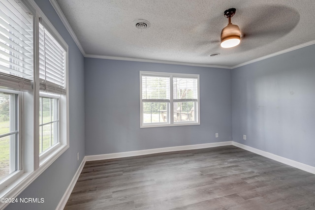 unfurnished room with ceiling fan, ornamental molding, a textured ceiling, and hardwood / wood-style floors