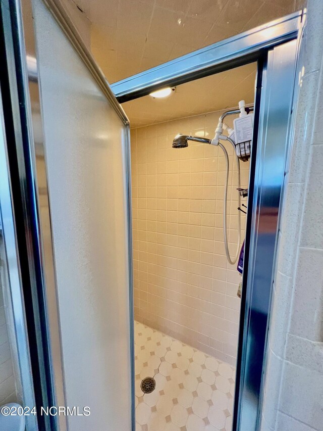 bathroom with a stall shower