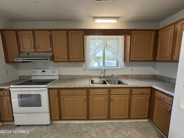 kitchen featuring white electric stove, light countertops, a textured ceiling, a sink, and exhaust hood