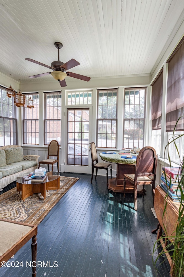 sunroom / solarium featuring wood ceiling and ceiling fan