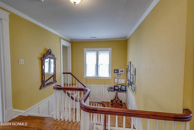 interior space featuring hardwood / wood-style floors and ornamental molding