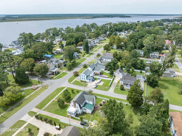 birds eye view of property featuring a water view and a residential view