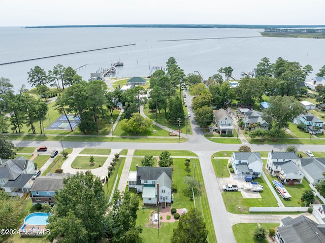 birds eye view of property with a residential view and a water view