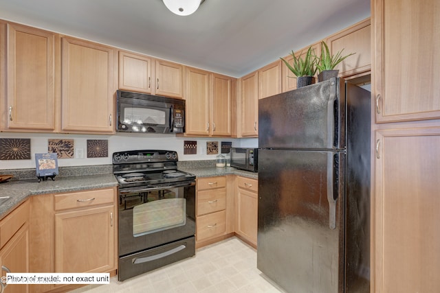 kitchen featuring black appliances, light brown cabinets, and light tile patterned floors