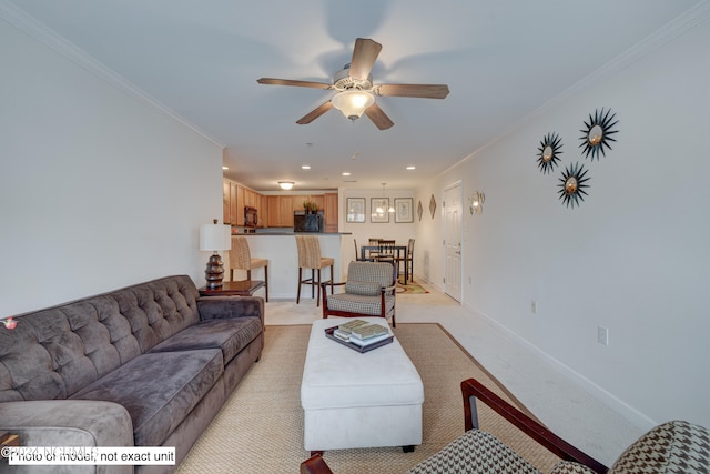 carpeted living room with ornamental molding and ceiling fan