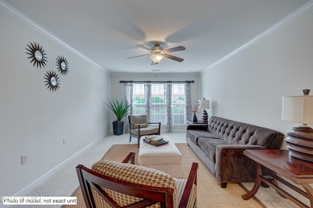 carpeted living room with ceiling fan and ornamental molding