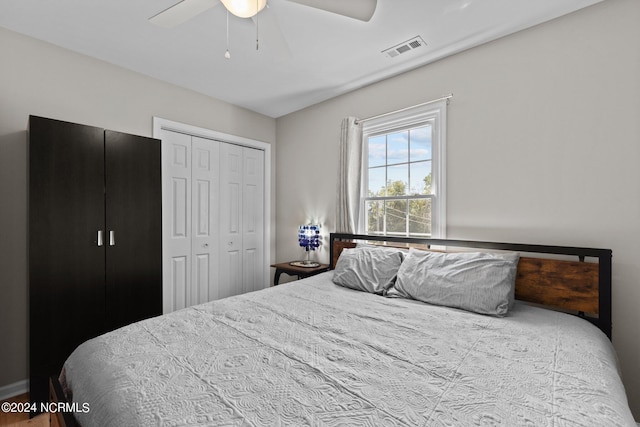 bedroom featuring ceiling fan and a closet