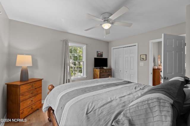 bedroom with light hardwood / wood-style floors, a closet, and ceiling fan