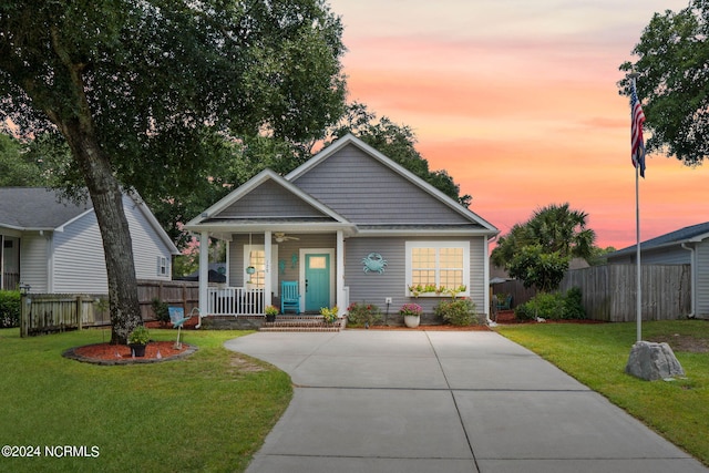 view of front of house featuring a lawn and a porch