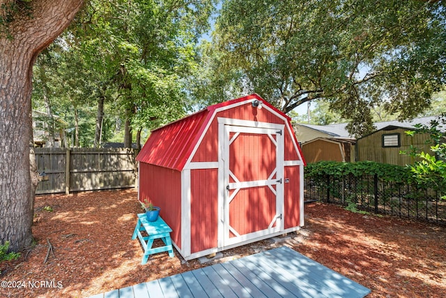 view of shed with fence