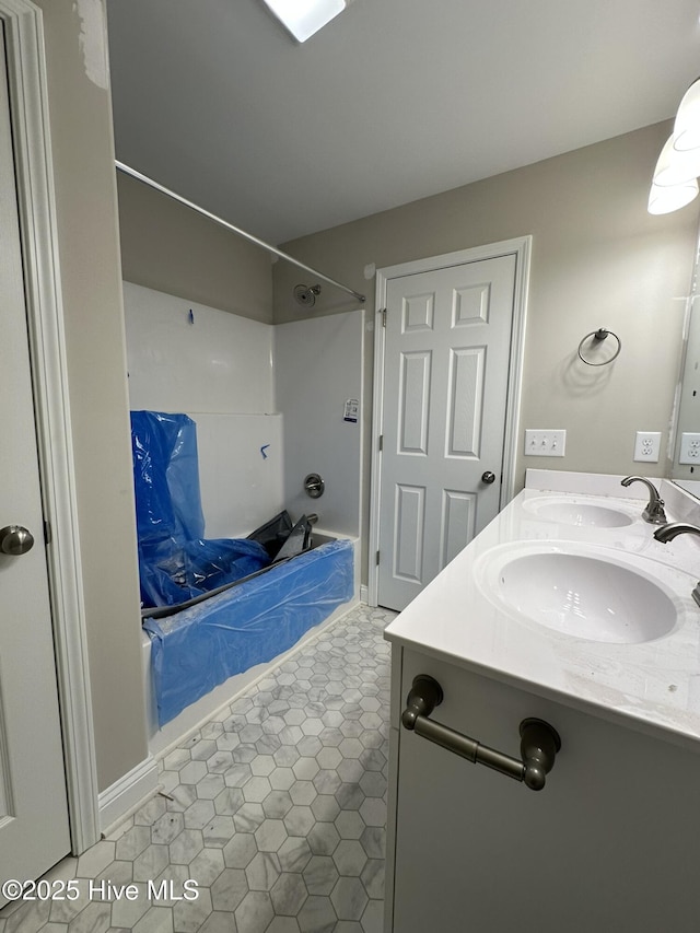 bathroom with vanity and washtub / shower combination