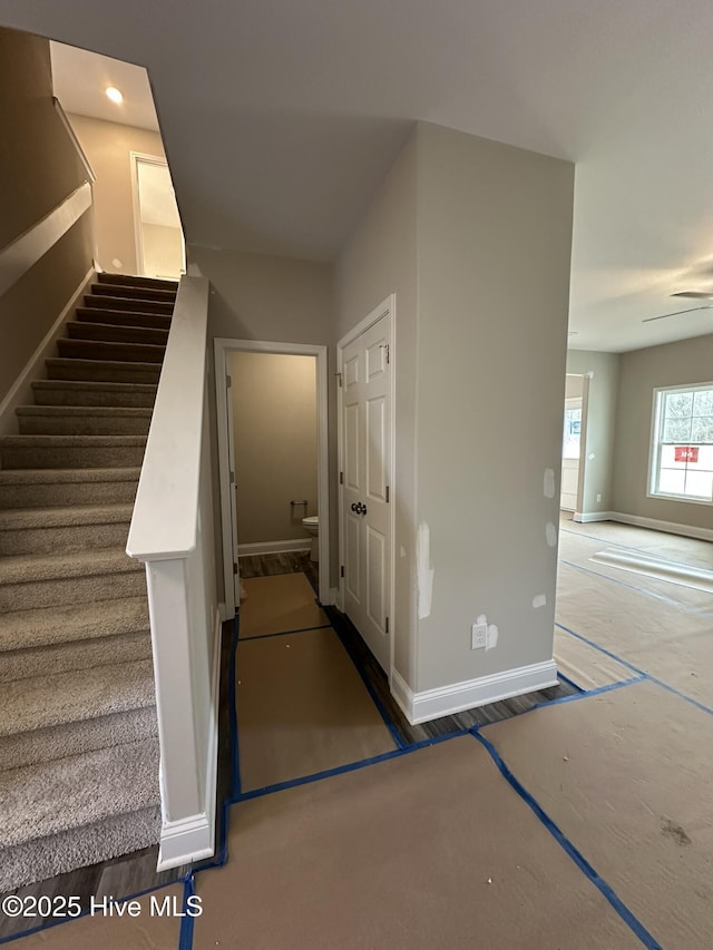 stairs with ceiling fan