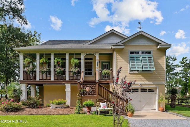 view of front of property featuring a garage and covered porch