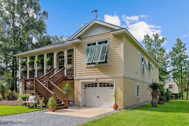 view of front facade featuring a front yard and a garage