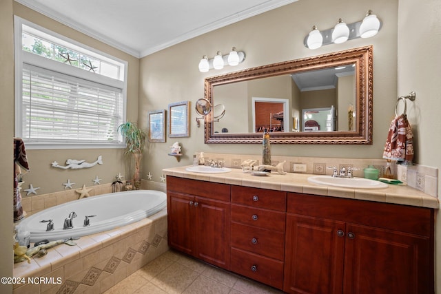 bathroom featuring crown molding, vanity, tiled tub, and tile patterned floors