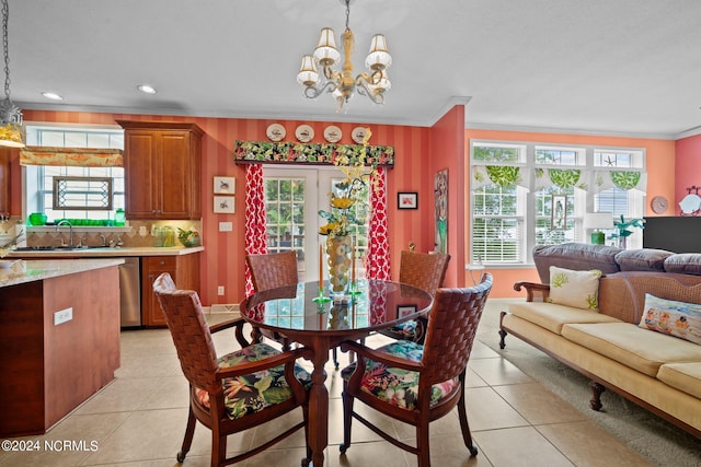 dining area with a healthy amount of sunlight, sink, and light tile patterned flooring