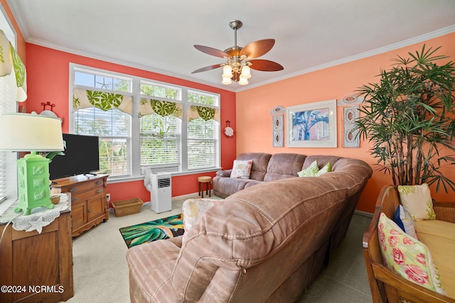 carpeted living room featuring crown molding and ceiling fan