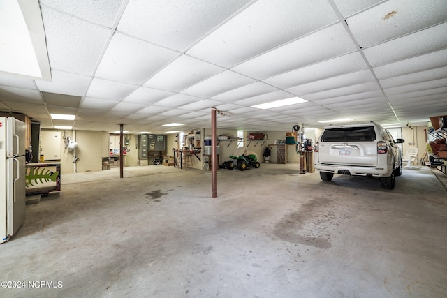 garage with stainless steel fridge