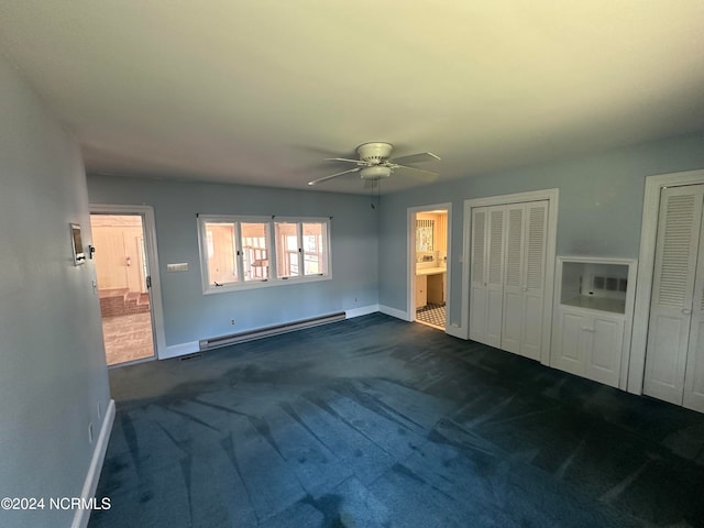 unfurnished bedroom with ceiling fan, dark colored carpet, and a baseboard heating unit