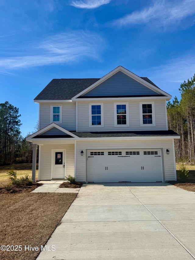 view of front facade featuring concrete driveway and a garage