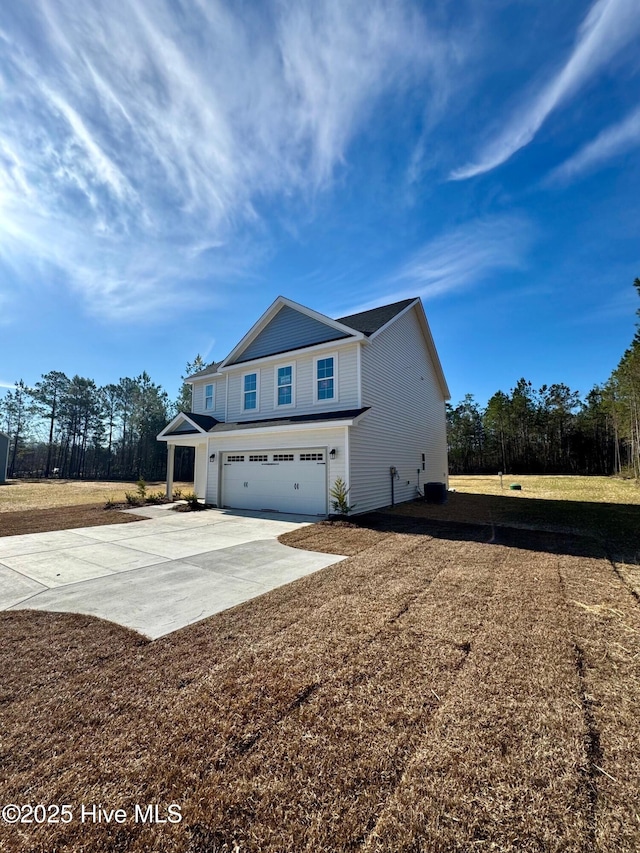 exterior space featuring concrete driveway and a garage