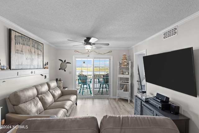 living room with ceiling fan, light hardwood / wood-style floors, and crown molding