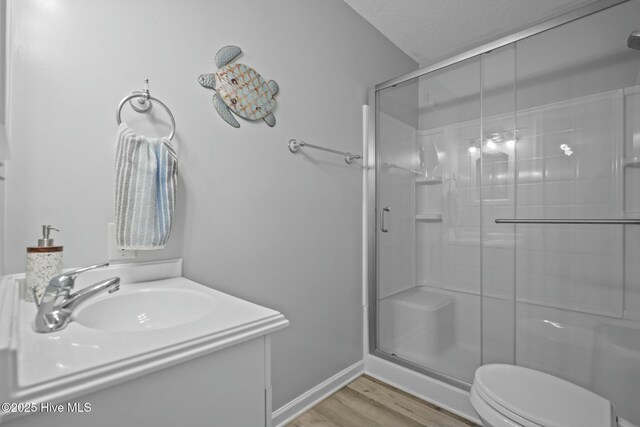 bedroom with ceiling fan, light wood-type flooring, access to outside, and a textured ceiling