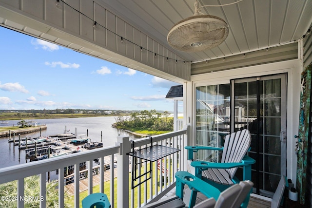 balcony featuring a water view