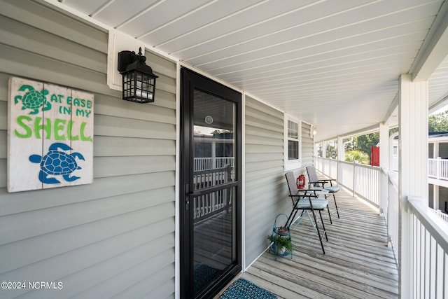 wooden deck featuring a porch