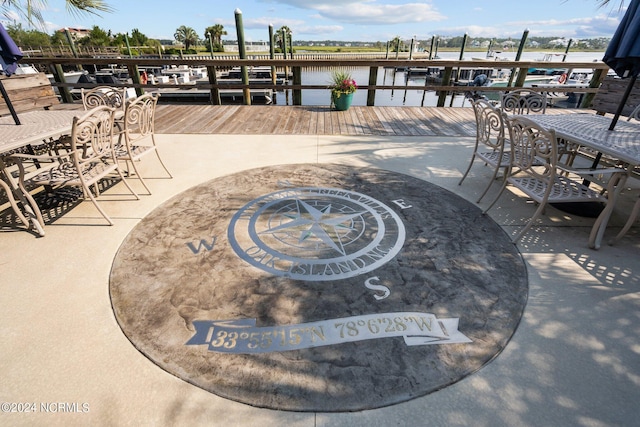 dock area with a water view