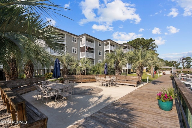 surrounding community with a patio area