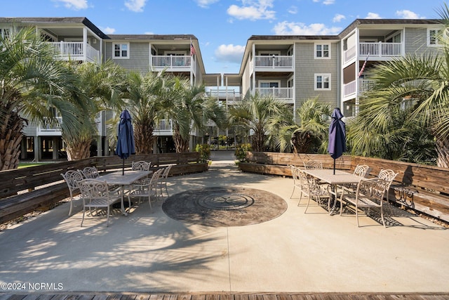 view of property's community featuring a patio area