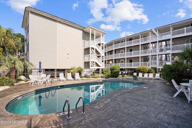 community pool featuring a patio