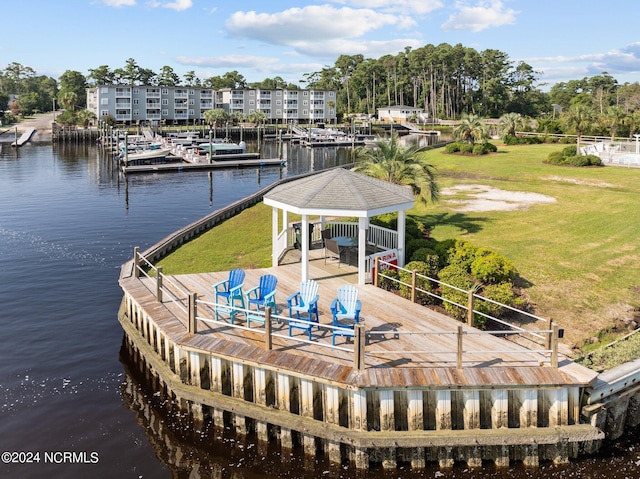 dock area featuring a water view, a yard, and a gazebo