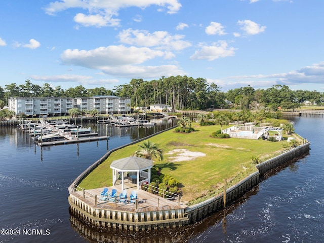 view of dock with a water view, a yard, and a gazebo