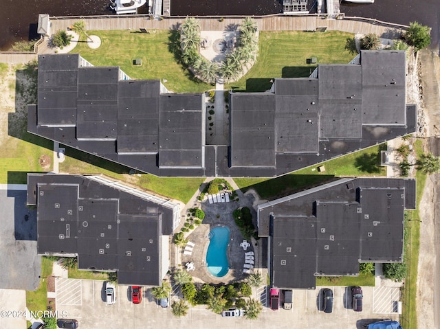 view of swimming pool with a water view and a patio area