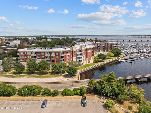 birds eye view of property with a water view