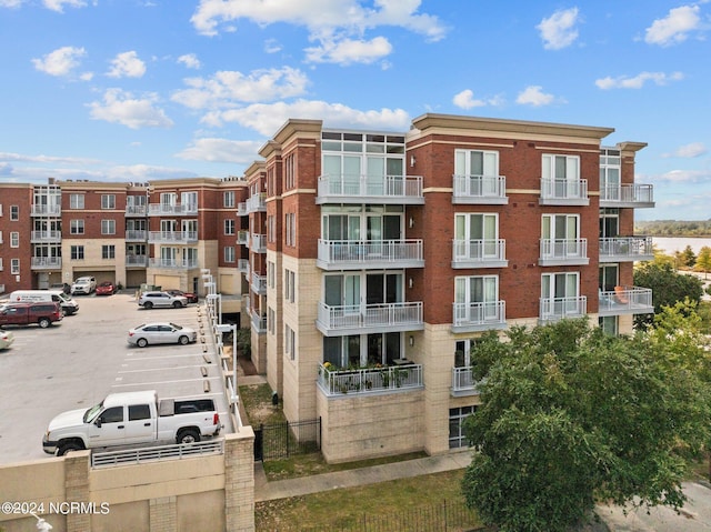 view of property featuring uncovered parking