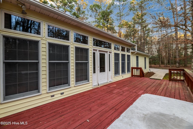 wooden deck with a patio