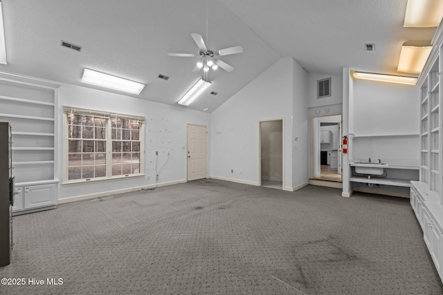 interior space with ceiling fan, carpet flooring, visible vents, and baseboards