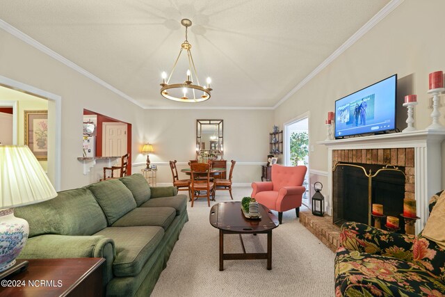 living room with ornamental molding, carpet, an inviting chandelier, and a brick fireplace