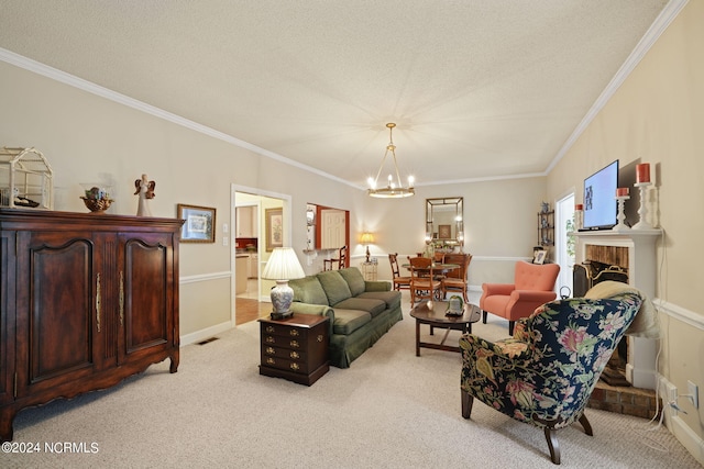 living room with a fireplace, ornamental molding, a notable chandelier, and light colored carpet